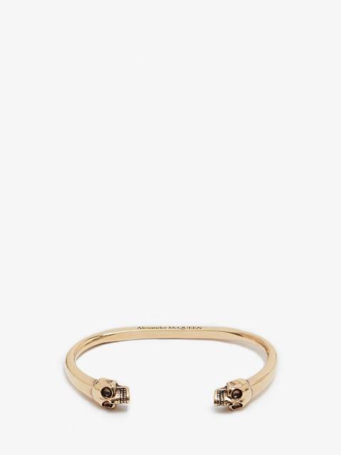 Alexander McQueen Twin Skull Bracelet in Gold