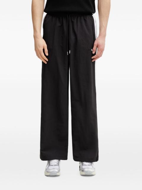 PUMA T7 logo-print side-stripe track pants