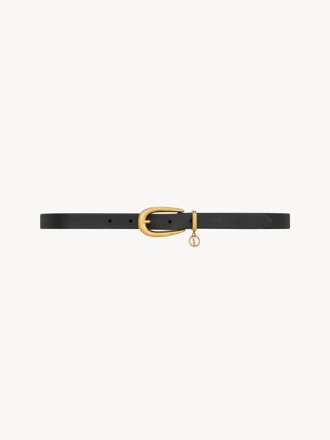 SAINT LAURENT CASSANDRE CHARM ELONGATED BUCKLE THIN BELT IN LEATHER