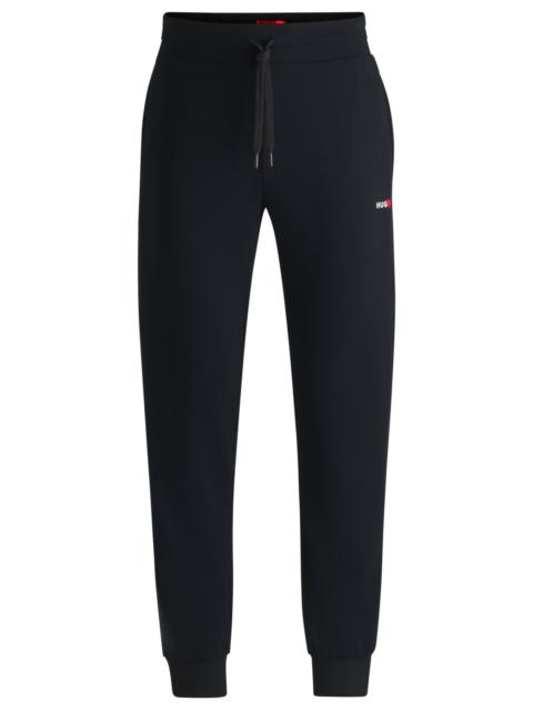 HUGO TRACKSUIT BOTTOMS WITH HEART LOGO