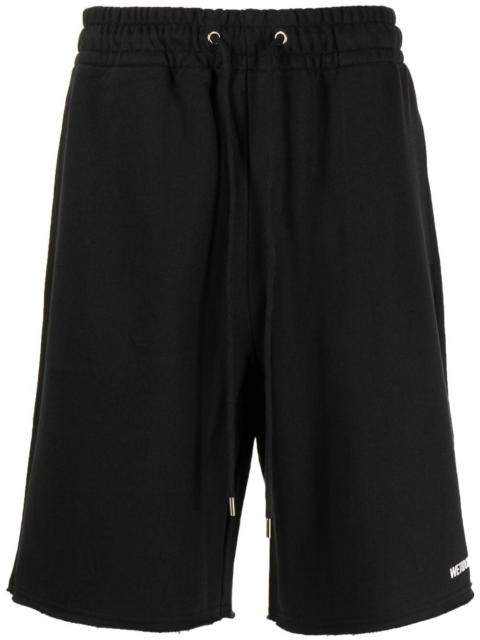 We11done logo-print shorts