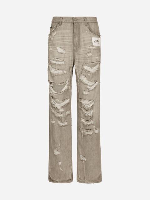 Washed oversize jeans with rips and abrasions