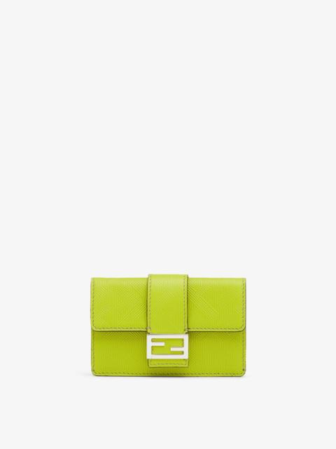 FENDI Baguette card holder with square flap and FF magnetic clasp. Can be worn on the waist. Made of acid 
