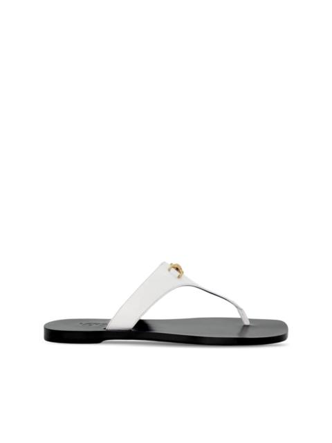 Medusa-plaque leather flip-flops