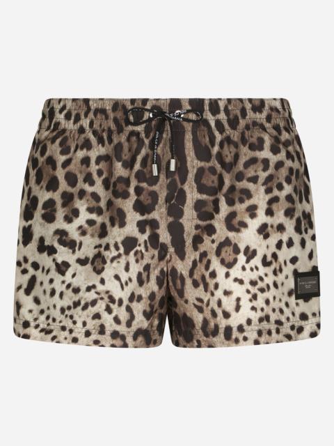 Short swim trunks with leopard print