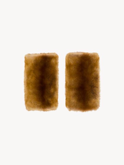 SAINT LAURENT MUFFS IN SHEARLING