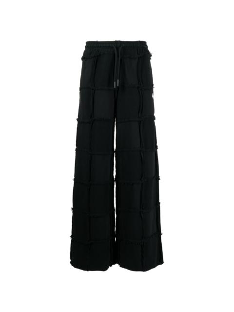 inside-out frayed drawstring trousers