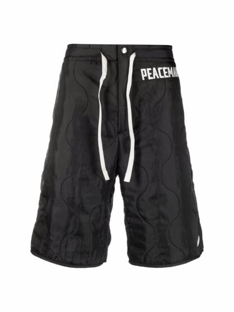 OAMC embroidered-logo quilted shorts