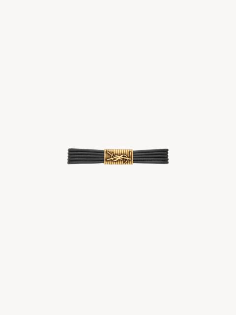 SAINT LAURENT CASSANDRE CORD BRACELET IN LEATHER AND METAL