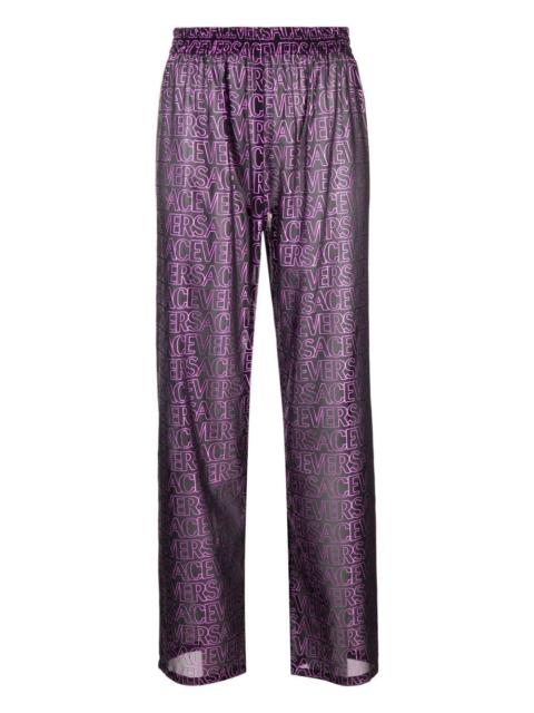 VERSACE logo-print semi-sheer pants