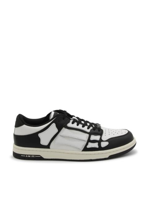 white and black skel low top sneakers