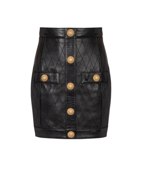 Topstitched leather skirt with buttons