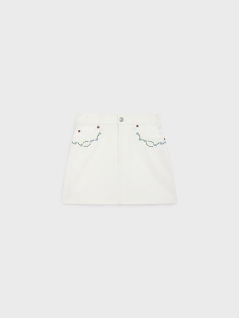 CELINE embroidered mini skirt in raw wash white denim