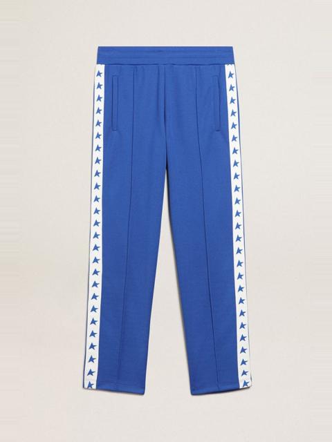 Men's blue joggers with band and stars on the sides