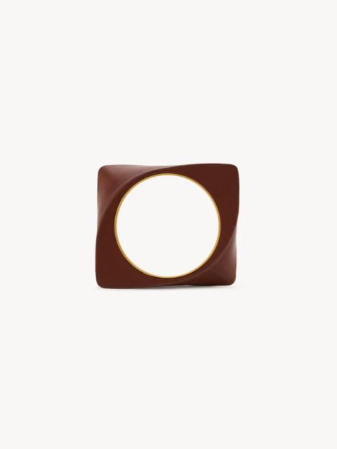 SAINT LAURENT TWISTED BLADE BANGLE IN LEATHER AND METAL