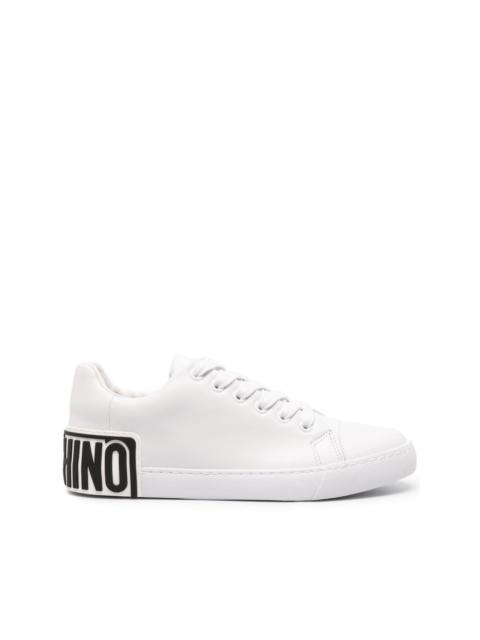 Moschino logo-embossed leather sneakers | REVERSIBLE