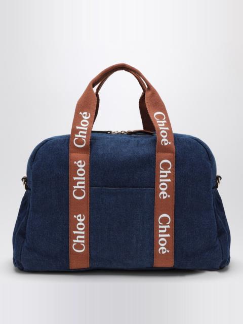 Blue denim changing bag with logo