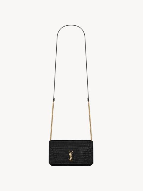 SAINT LAURENT CASSANDRE PHONE HOLDER IN SHINY CROCODILE-EMBOSSED LEATHER