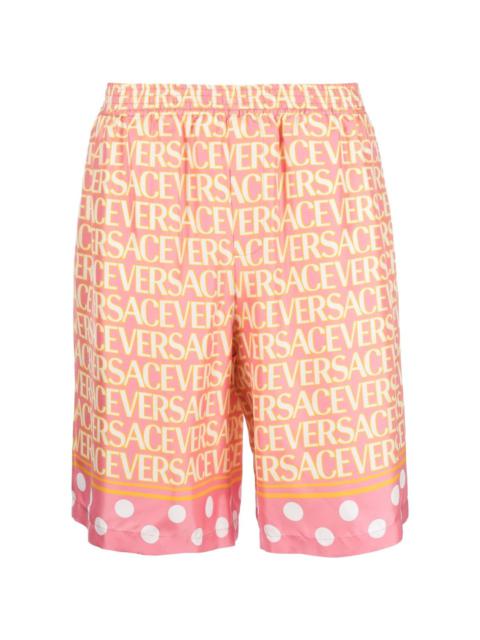 Versace Allover logo-print silk shorts