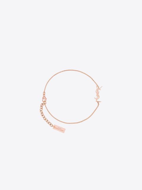 SAINT LAURENT charm bracelet in rose gold brass