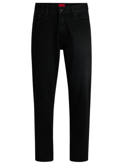 HUGO TAPERED-FIT JEANS IN BLACK DENIM