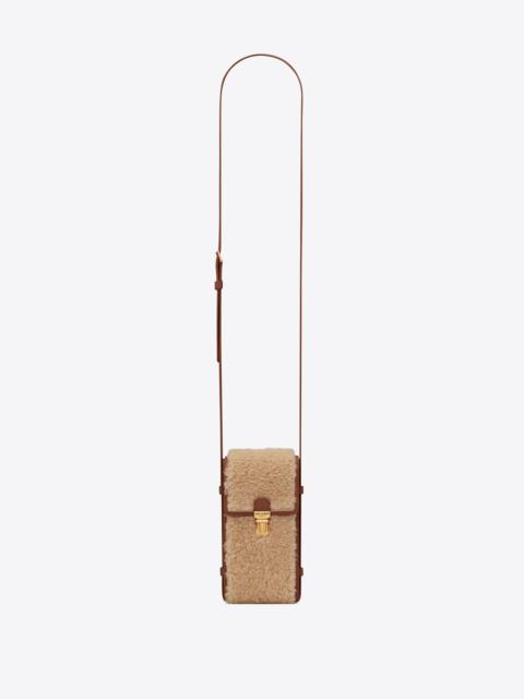 SAINT LAURENT tuc phone pouch with strap in shearling and vegetable-tanned leather