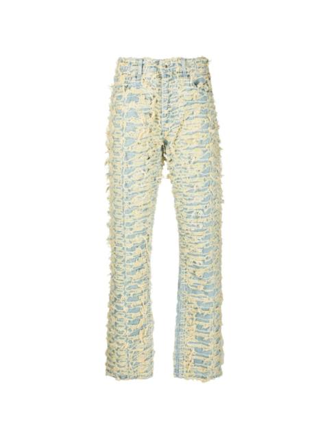 WHO DECIDES WAR distressed logo-patch jeans