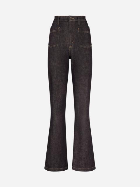 Flared jeans with tobacco-colored stitching