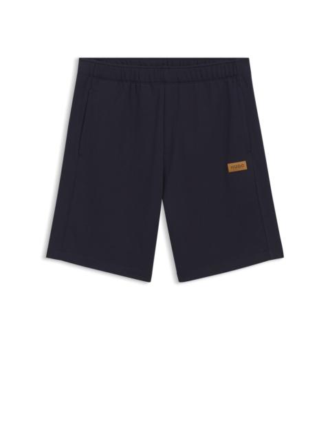 HUGO REGULAR-FIT SHORTS IN COTTON WITH SUEDE LOGO BADGE