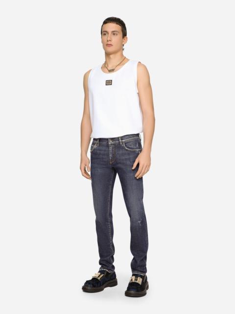 Mid blue skinny stretch jeans with abrasions