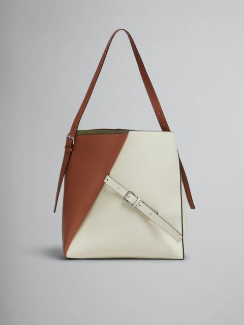 BROWN AND WHITE LEATHER REVERSE HOBO BAG