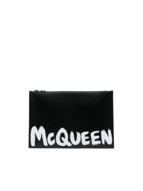 logo-print leather clutch bag