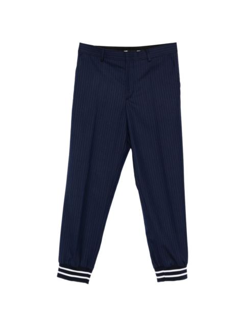 Moschino striped-cuff trousers
