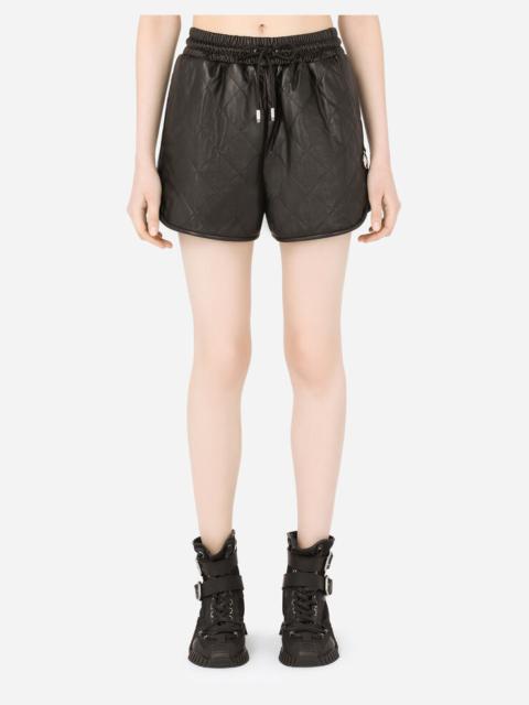 Dolce & Gabbana Quilted leather shorts with DG pendant