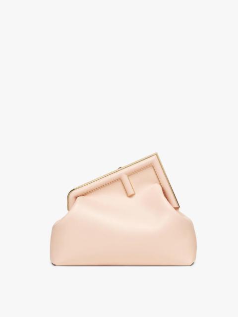 FENDI Medium Fendi First bag made of soft, pale pink nappa leather with an oversized metal F clasp bound i