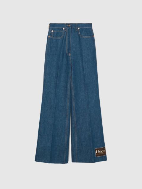GUCCI Washed denim flare pant with Gucci label