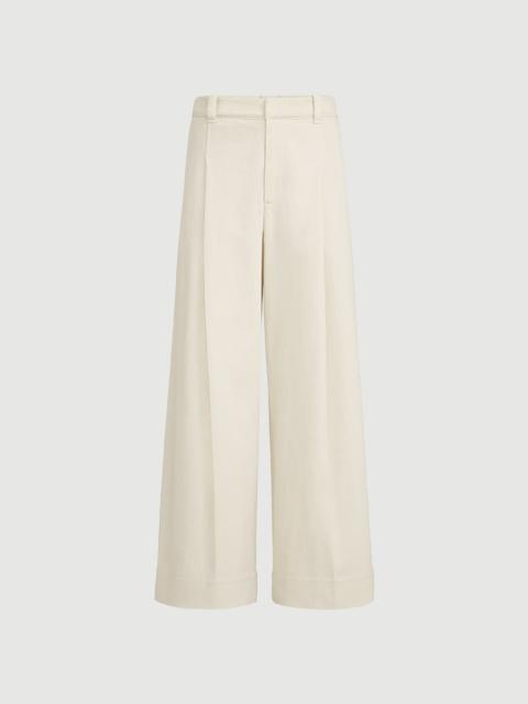 Brunello Cucinelli Stretch dyed denim pleated A-line trousers with monili