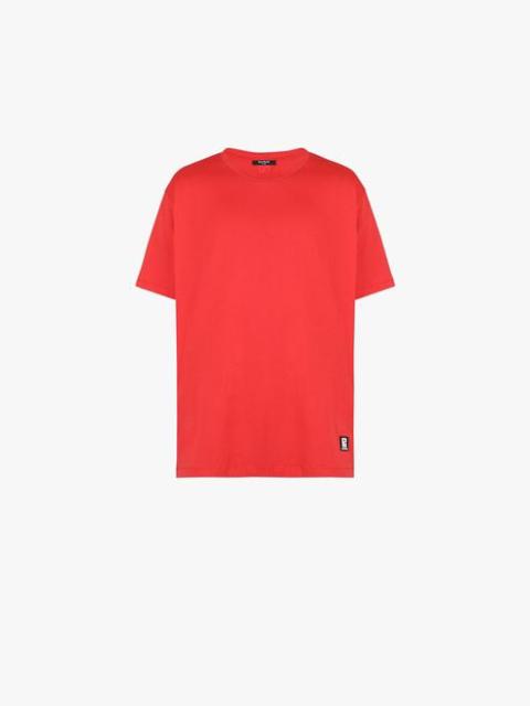 Oversized red eco-designed cotton T-shirt with white Balmain logo print