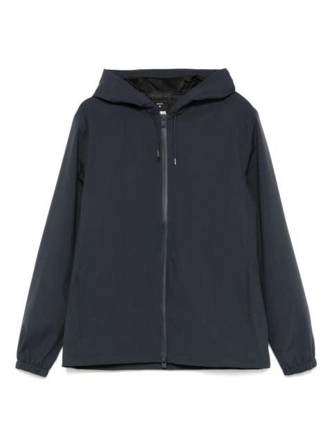 RAINS The SUVA HARDSHELL JACKET, a stunning coat from RAINS, redefines modern outerwear. Crafted from high