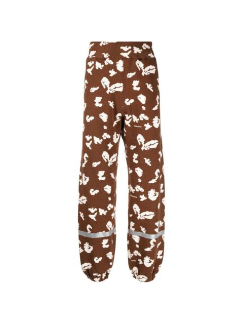 UNDERCOVER abstract-print track pants