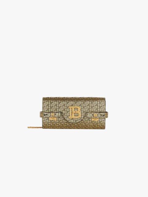 Balmain Bicolor gold and black leather B-Buzz clutch bag