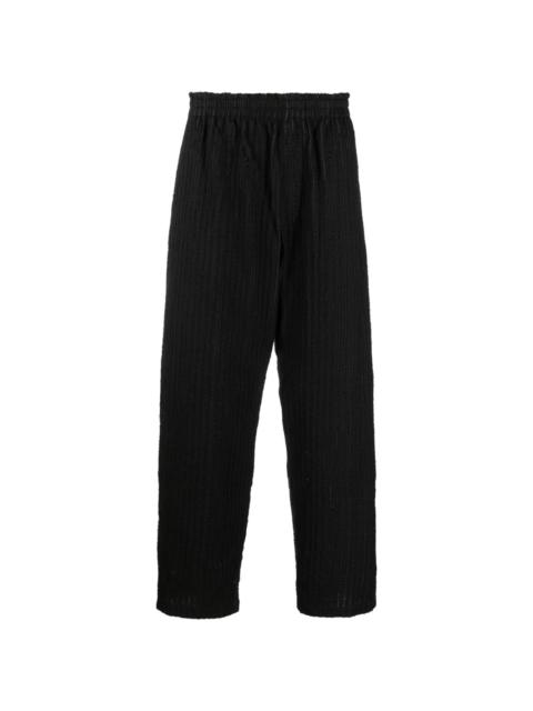 ripped striped straight-leg trousers