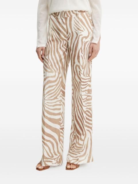 GUESS USA x Marciano animal-print trousers