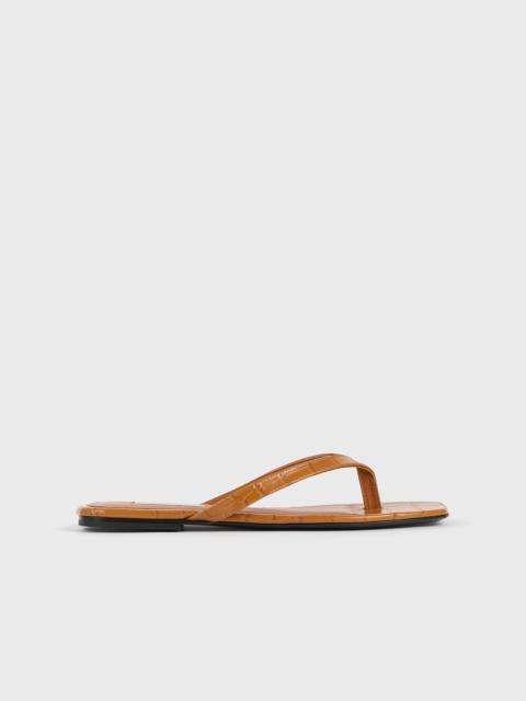 TOTEME Croco-embossed flip flops tangerine