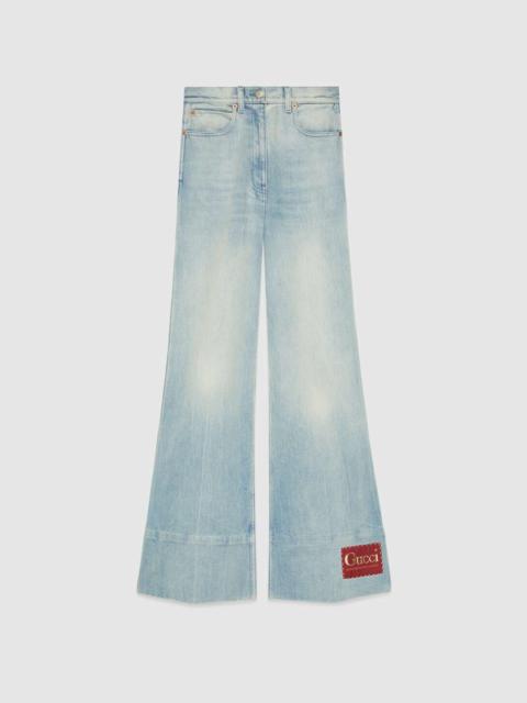 GUCCI Washed denim flare pant with Gucci label