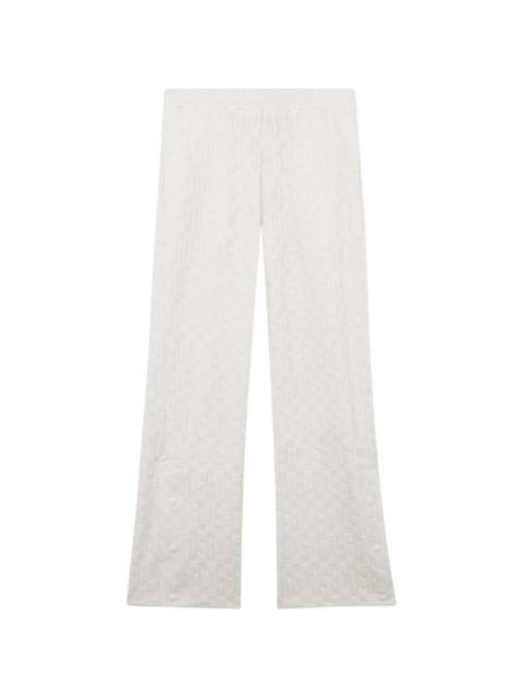 GCDS monogram-pattern trousers