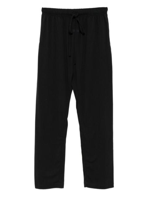 ESSENTIALS logo-patch trousers