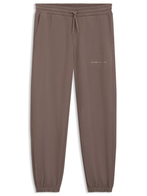 HUGO RELAXED-FIT COTTON PANTS WITH STREETWEAR LOGO
