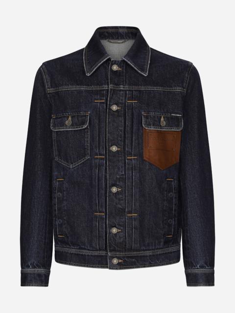Denim jacket with embossed tag on leather