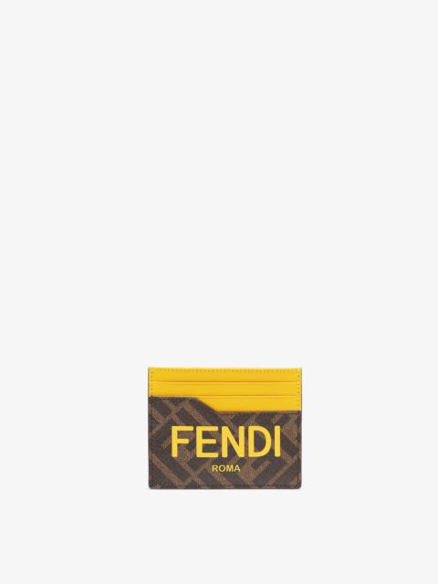 FENDI Card holder with central flat pocket and 6 slots. Made of textured fabric with FF motif in brown and